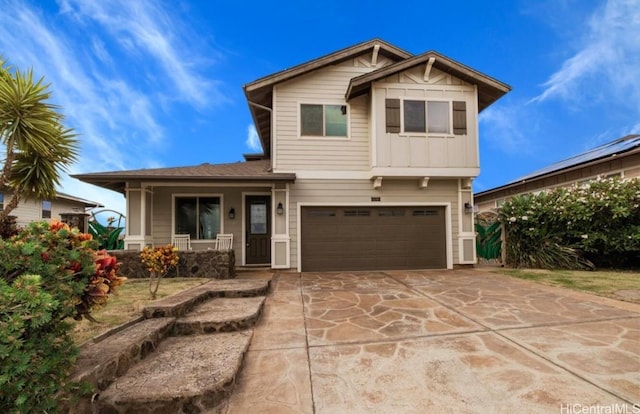 view of front of house with a porch and a garage