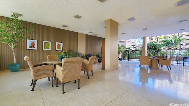 dining space featuring a textured ceiling