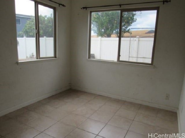 empty room with light tile patterned floors