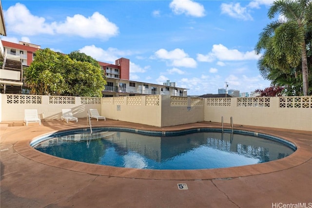 view of pool featuring a patio area