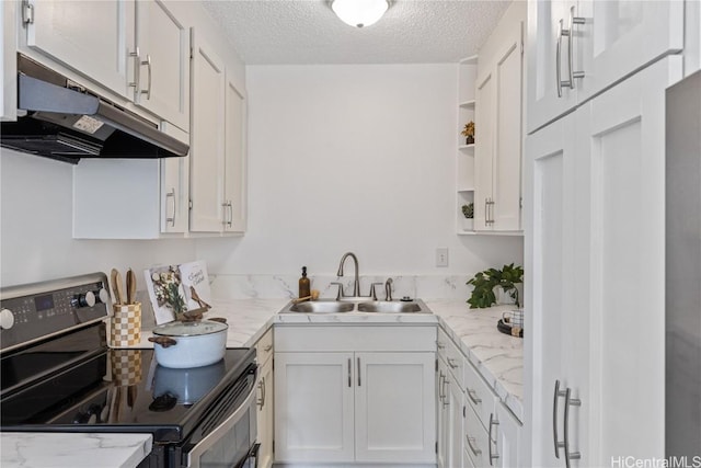 kitchen with black electric range oven, sink, light stone countertops, a textured ceiling, and white cabinetry