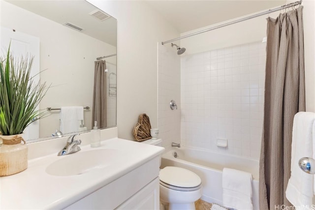 full bathroom with vanity, toilet, and shower / tub combo with curtain