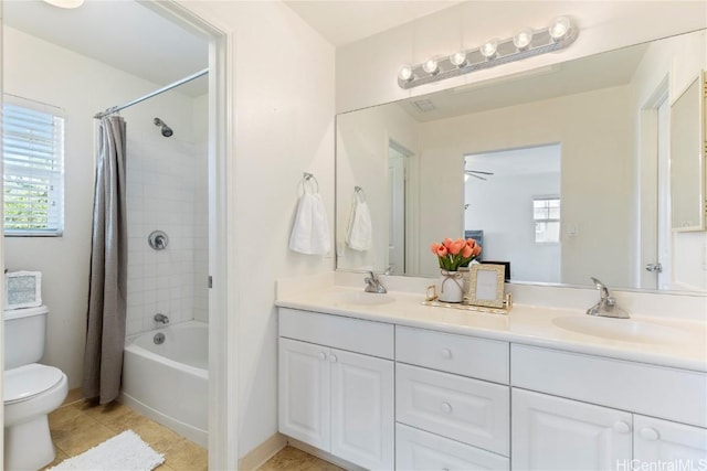 full bathroom with toilet, shower / bath combination with curtain, vanity, and tile patterned floors