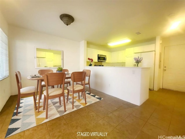 dining room featuring light tile patterned floors