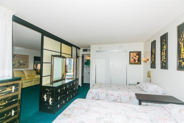 carpeted bedroom featuring a closet