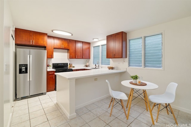 kitchen featuring kitchen peninsula, stainless steel refrigerator with ice dispenser, sink, light tile patterned floors, and black / electric stove