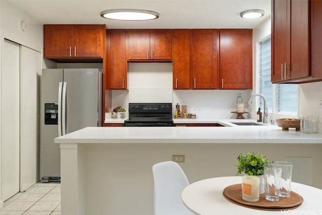 kitchen with kitchen peninsula, sink, light tile patterned floors, black electric range, and stainless steel fridge with ice dispenser