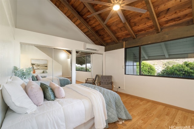 bedroom featuring two closets, light hardwood / wood-style flooring, ceiling fan, beamed ceiling, and wood ceiling