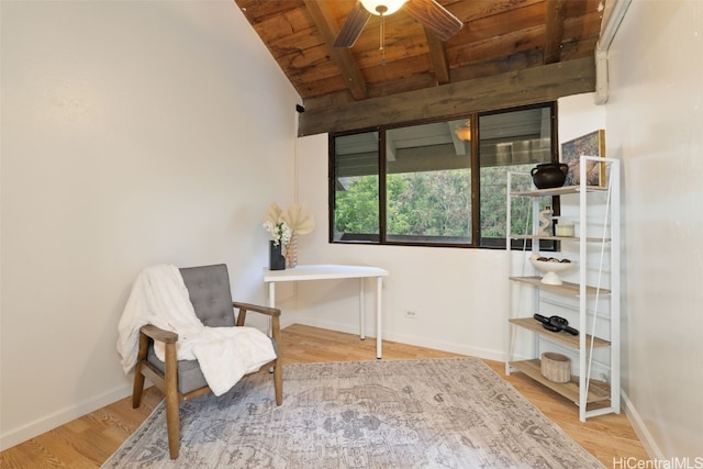 living area featuring lofted ceiling with beams, hardwood / wood-style floors, ceiling fan, and wooden ceiling