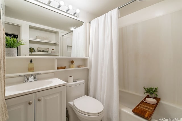 full bathroom featuring shower / tub combo, vanity, and toilet