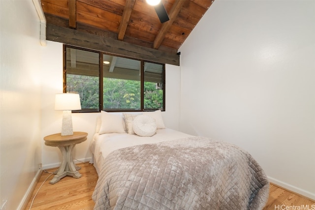 bedroom featuring hardwood / wood-style flooring, lofted ceiling with beams, ceiling fan, and wood ceiling