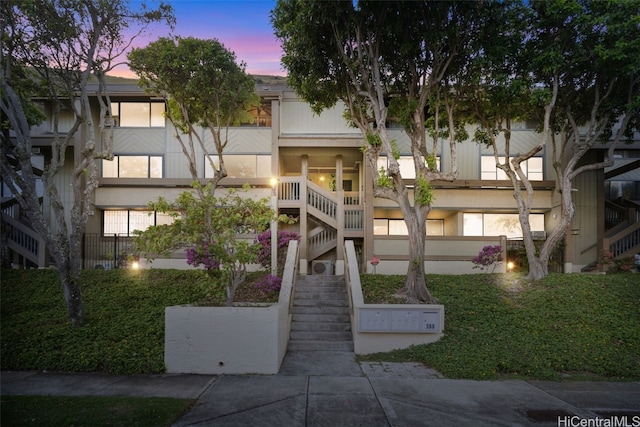 view of outdoor building at dusk