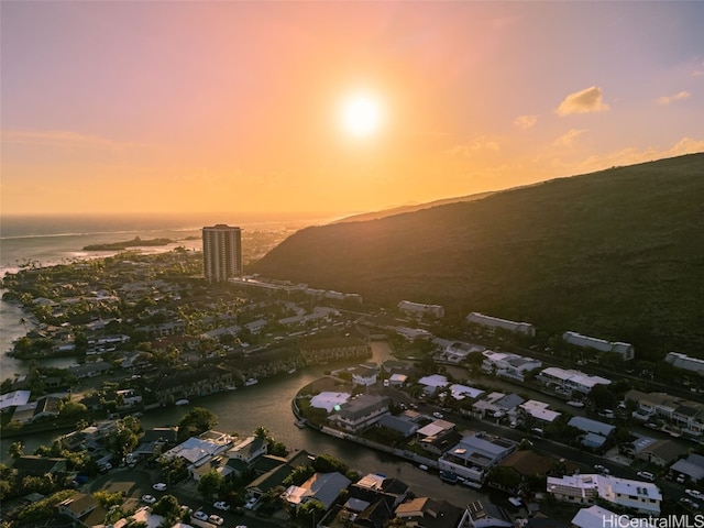 aerial view at dusk with a water view