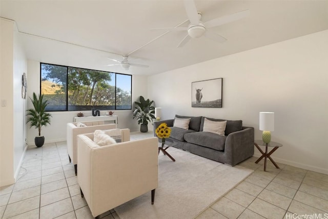 living room with ceiling fan and light tile patterned flooring