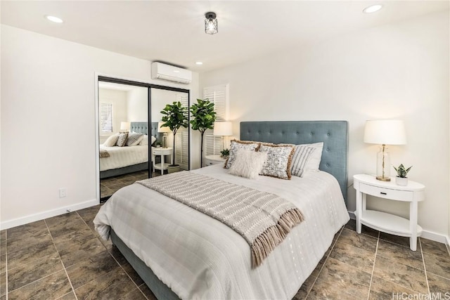 bedroom featuring a wall unit AC