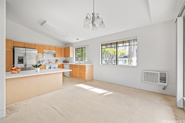 kitchen with white appliances, hanging light fixtures, vaulted ceiling, a notable chandelier, and heating unit