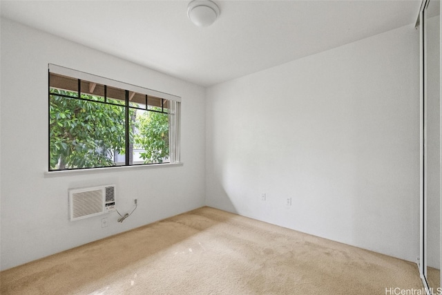 unfurnished room with carpet floors and a wall mounted AC