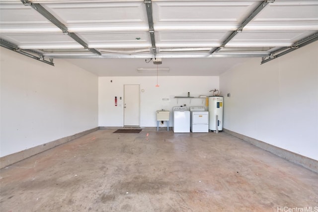 garage with electric water heater, sink, a garage door opener, and independent washer and dryer