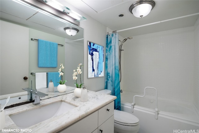 full bathroom with shower / tub combo with curtain, vanity, and toilet