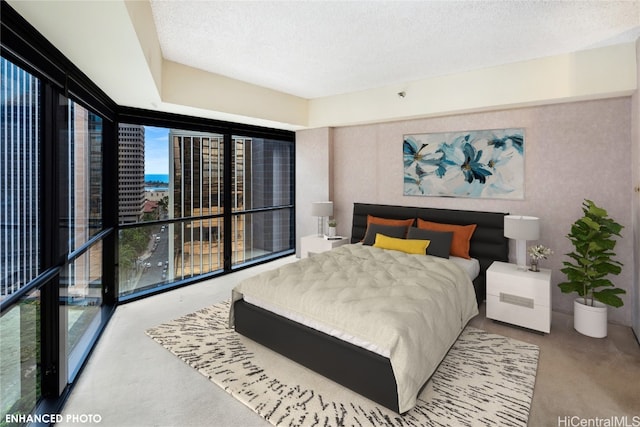 carpeted bedroom featuring a textured ceiling