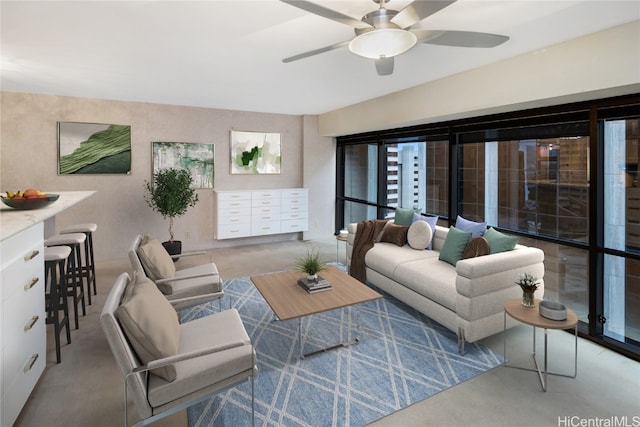 living room featuring light carpet and ceiling fan