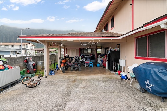 exterior space with a mountain view and a carport