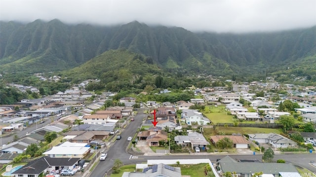 birds eye view of property with a mountain view