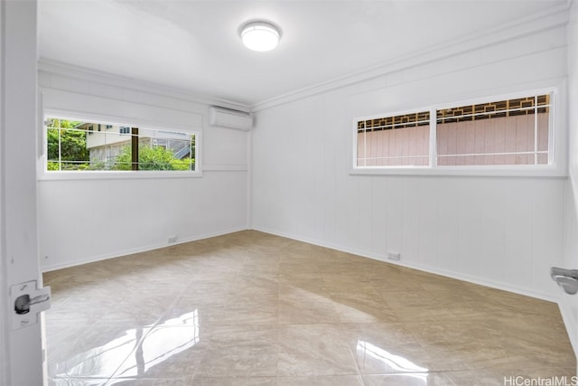 empty room with an AC wall unit and crown molding