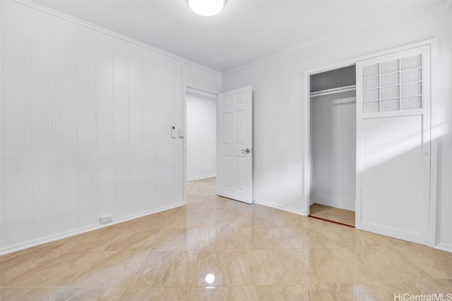 unfurnished bedroom featuring a closet and ornamental molding