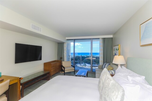 bedroom with access to exterior and floor to ceiling windows