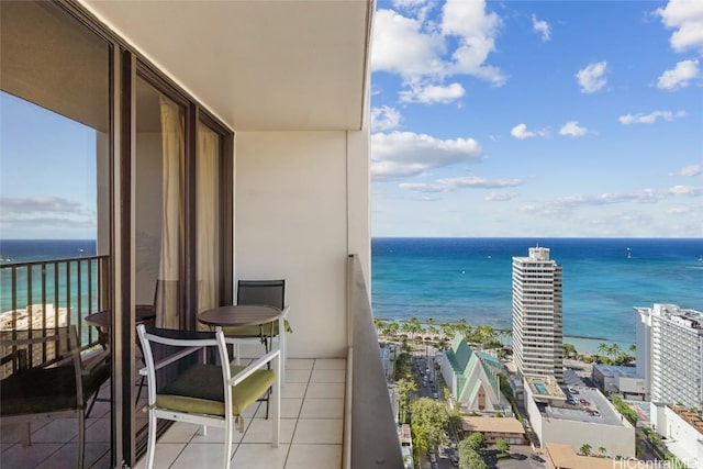 balcony featuring a water view