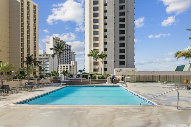 view of swimming pool with a patio area