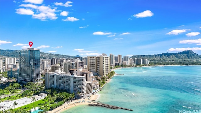 property view of water featuring a mountain view and a beach view