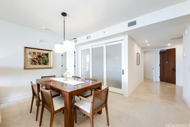 dining room featuring light colored carpet