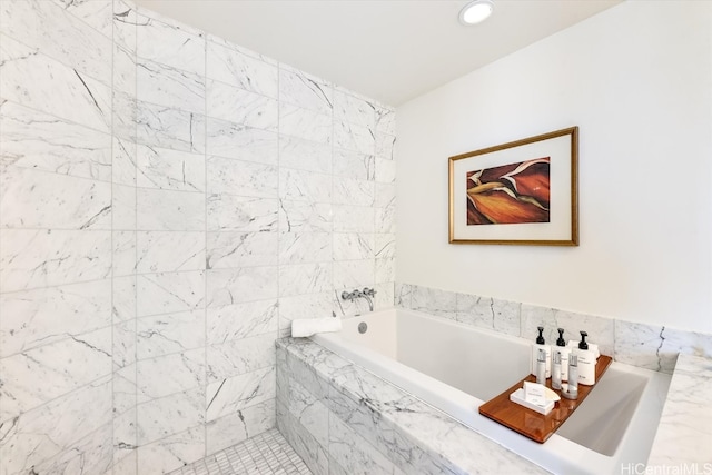 bathroom featuring tiled bath