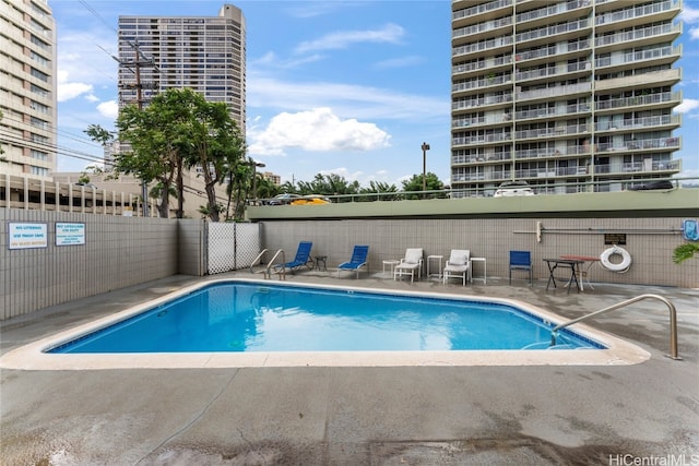 view of swimming pool featuring a patio