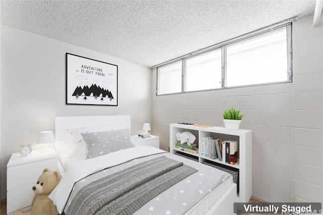 bedroom featuring a textured ceiling