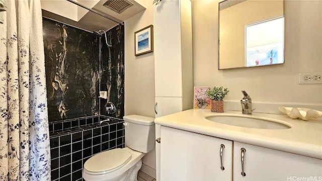 bathroom featuring vanity, toilet, walk in shower, and tile walls