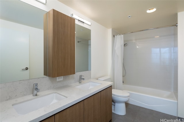 full bathroom with tile patterned floors, shower / bath combo, toilet, and vanity