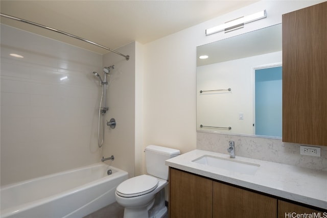 full bathroom with tiled shower / bath combo, toilet, and vanity