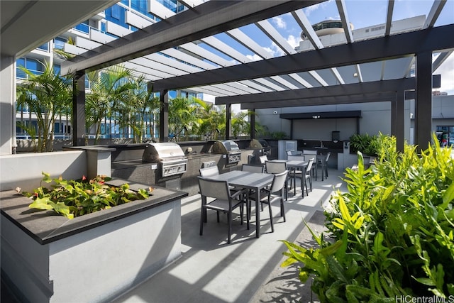 view of patio with a pergola, area for grilling, and grilling area