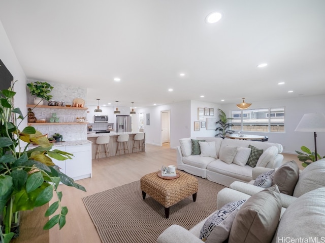 living room with light hardwood / wood-style flooring