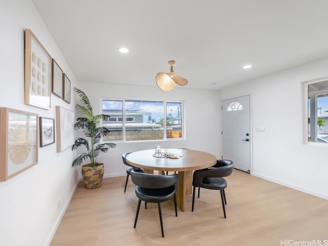 dining space with light wood-type flooring