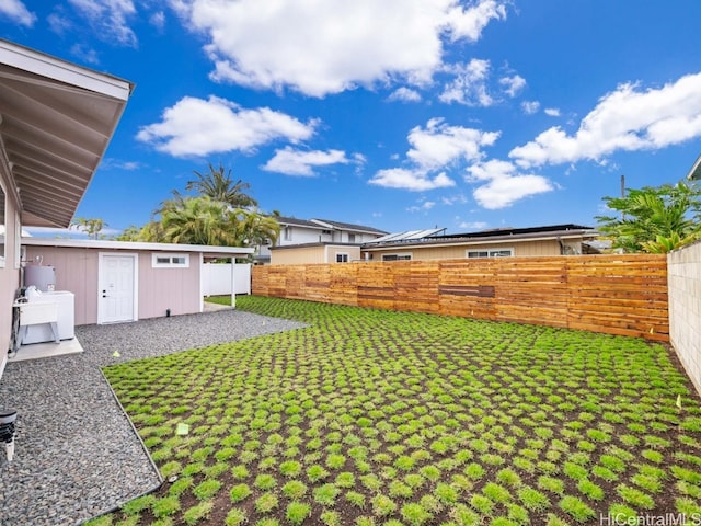 view of yard with a patio area and an outdoor structure