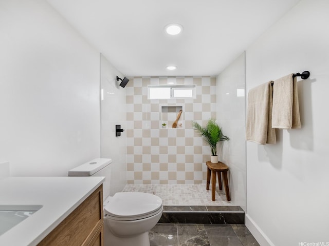 624 Olomana St, Kailua, HI 96734 - bathroom with toilet, a tile shower, recessed lighting, and marble finish floors