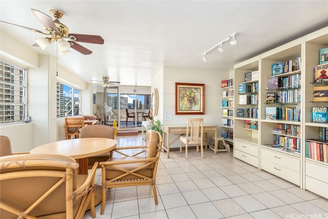 dining room featuring light tile patterned floors, rail lighting, and ceiling fan