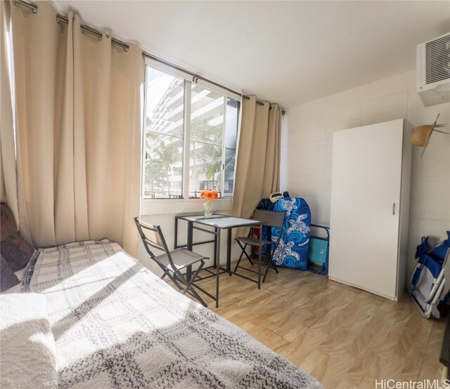 bedroom featuring light parquet floors