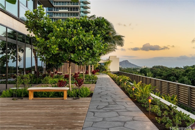 surrounding community featuring a deck with mountain view