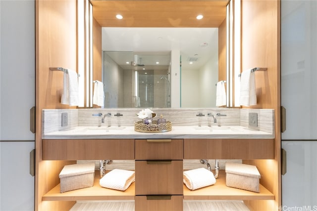 bathroom with vanity and walk in shower