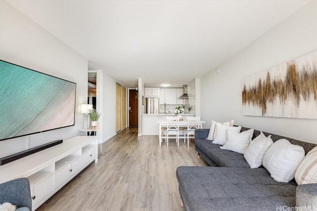 living area with light wood-style floors